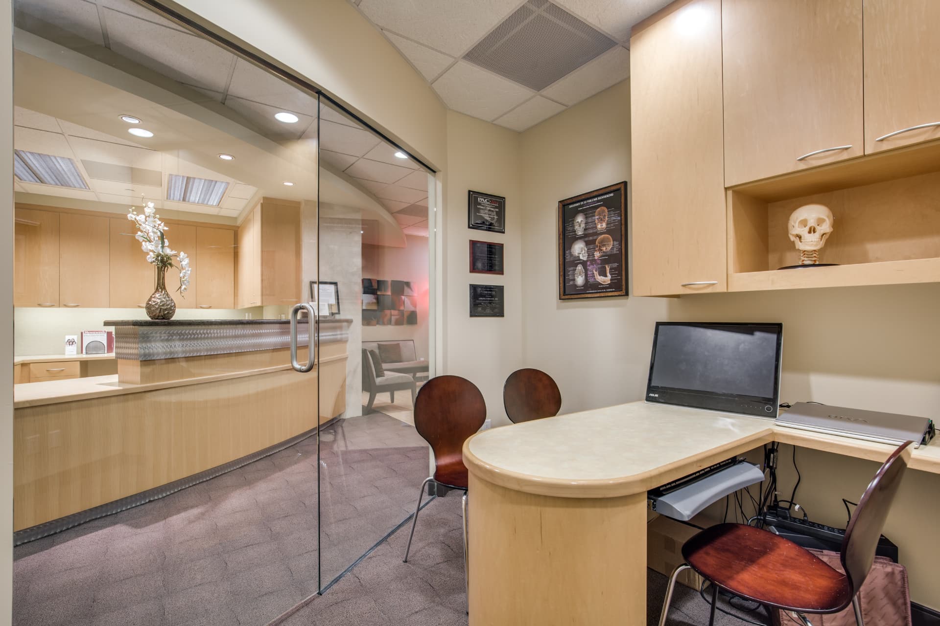 Private consultation room at Uptown Dentistry where Dr. Tajalli reviews treatment plans with patients