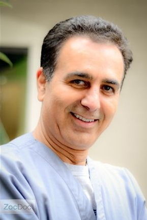 Portrait of Dr. Sid Ahmadi, the visiting implant and oral surgery specialist who treats Uptown Dentistry patients